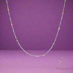 Load image into Gallery viewer, A sterling silver chain with a dual color feature, showcasing silver balls on its links with a close-up inset of the chain's texture.