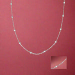 Load image into Gallery viewer, A sterling silver necklace featuring a chain with interlinked silver links and a pendant.