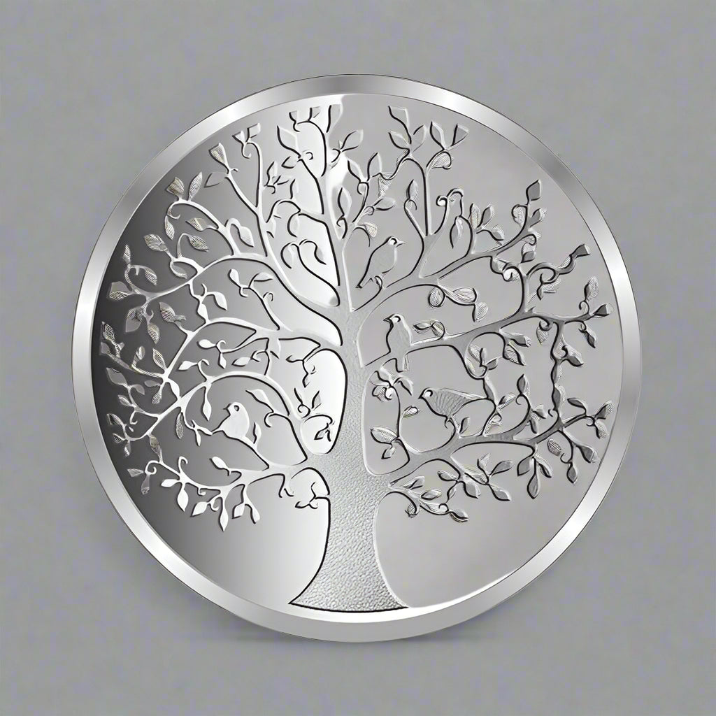 A silver coin with an intricate design depicting the 'Tree of Life'.