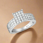 Load image into Gallery viewer, A 925 sterling silver ring with a quadruple band design and AAA cubic zirconia embellishments.