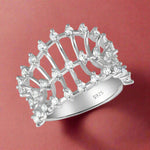 Load image into Gallery viewer, A 925 sterling silver ring with multiple clear cubic zirconia embellishments.