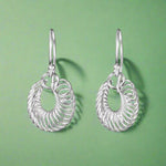 Load image into Gallery viewer, A pair of sterling silver hoop earrings with a linked chain design, displayed against a white background.