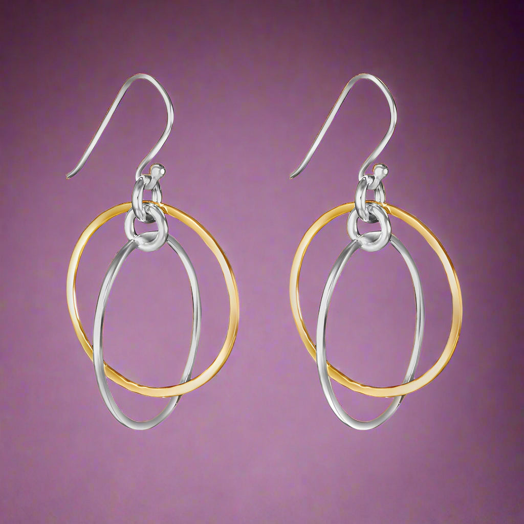 A pair of two-tone round 925 sterling silver hook earrings with one earring featuring gold-colored loops and silver-colored loops on the other, displayed against a white background.