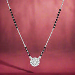 Load image into Gallery viewer, A sterling silver mangalsutra necklace with a black bead design and a central solitaire pendant.