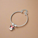 Load image into Gallery viewer, A silver bracelet featuring a charms with a cartoon character's face, designed for kids.