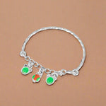Load image into Gallery viewer, A silver kids' bracelet with green and orange accents designed for newborns to 3 years old.