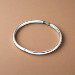 Load image into Gallery viewer, A 925 silver bracelet with a simple design, circular in shape and crafted for children.