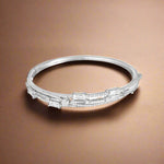 Load image into Gallery viewer, A sterling silver bracelet adorned with cubic zirconia stones.