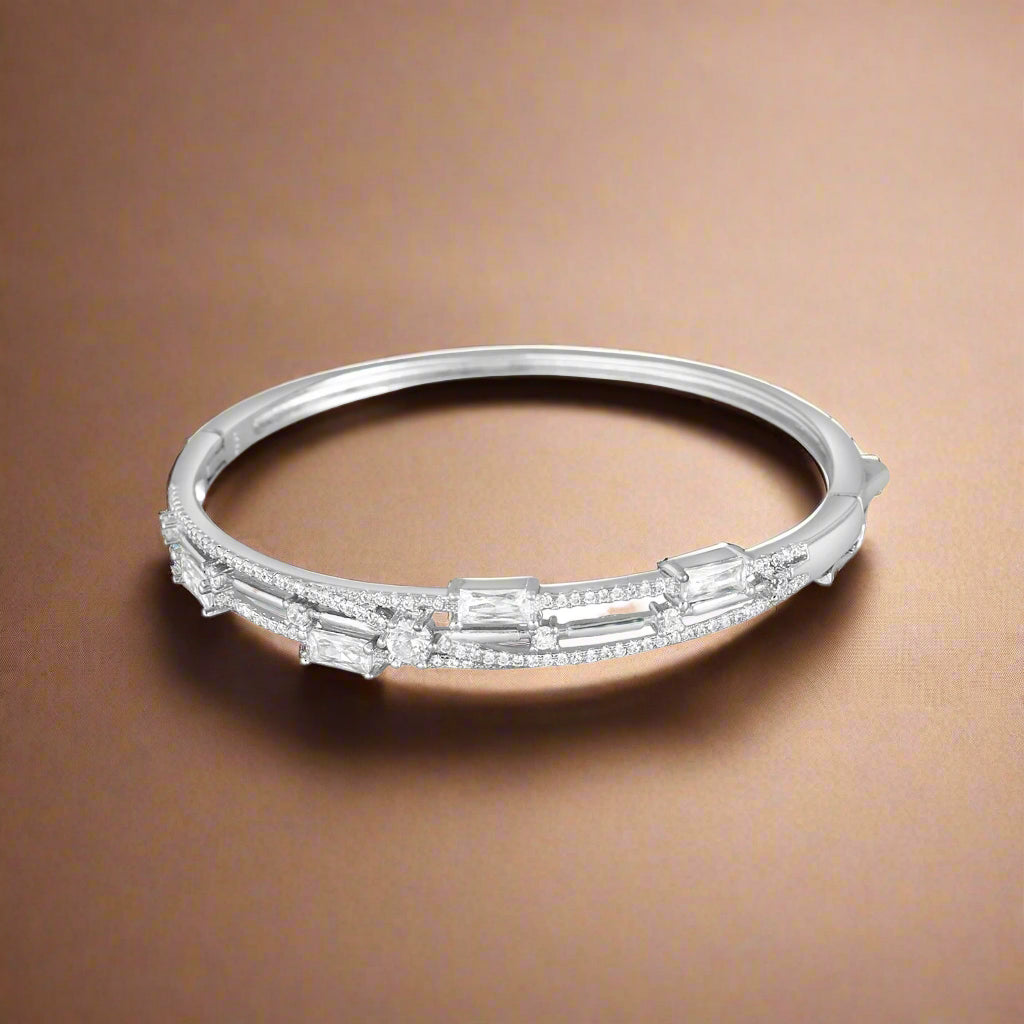A sterling silver bracelet adorned with cubic zirconia stones.