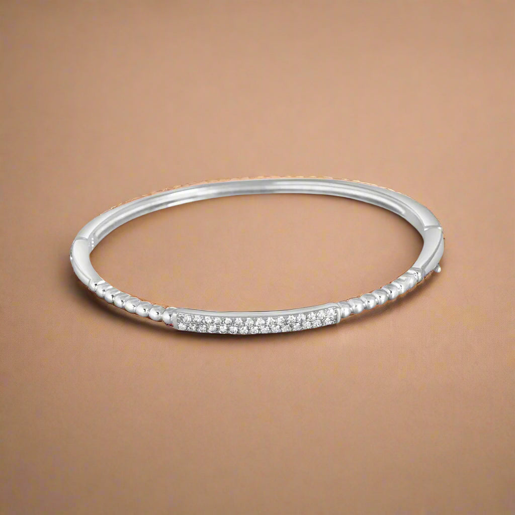 A sterling silver bracelet with cubic zirconia accents.