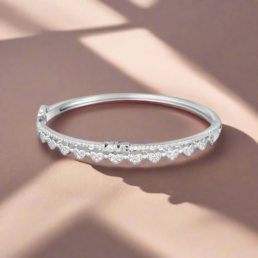 A sterling silver bracelet featuring a series of cubic zirconia stones set around its circumference.