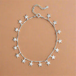 Load image into Gallery viewer, Silver star-shaped bracelet on a white background