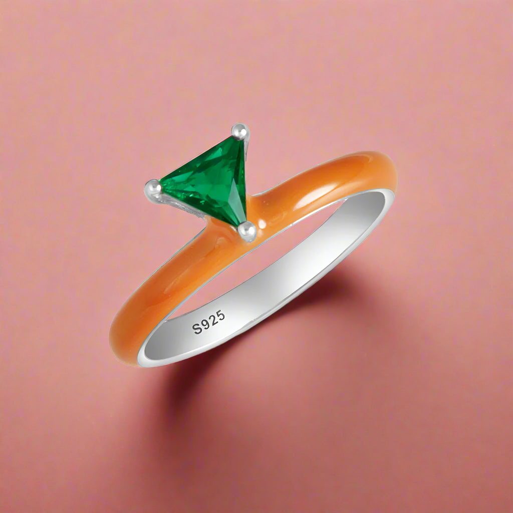 A sterling silver ring with a multicolored enamel coating and a central cubic zirconia stone, surrounded by smaller clear cubic zirconia's on the band.