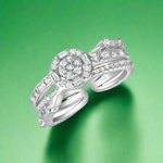 Load image into Gallery viewer, A round 925 sterling silver ring with a central cubic zircon embellishment and clear AAA cubic zircons set in a polished band.