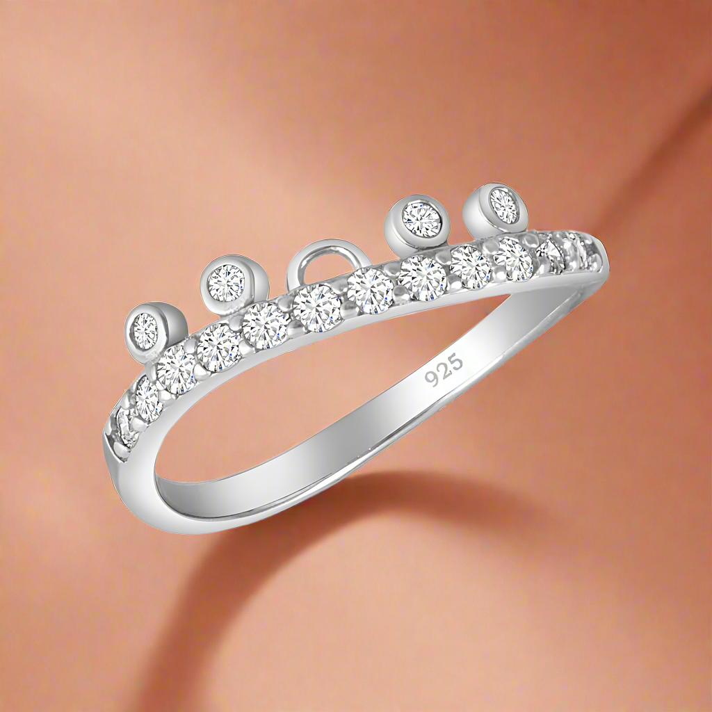 A sterling silver ring with a band of AAA cubic zirconia stones set around its circumference.