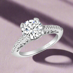 Load image into Gallery viewer, A 925 sterling silver solitaire ring with a large central cubic zirconia and smaller stones on the band, set against a white background.