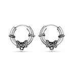 Load image into Gallery viewer, Pair of silver hoop earrings with decorative beads on a white background
