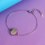 Load image into Gallery viewer, Bracelet with a colorful charm on a purple and blue background
