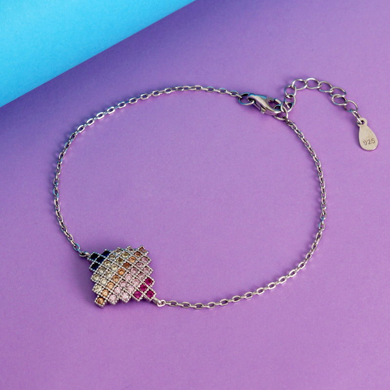 Bracelet with a colorful charm on a purple and blue background