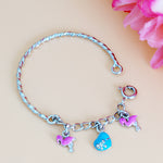 Load image into Gallery viewer, Bracelet with colorful charms on a light pink background
