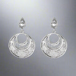 Load image into Gallery viewer, Pair of silver earrings with intricate designs on a gray background
