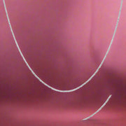A sterling silver necklace with a modern link chain design.