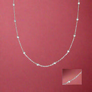A sterling silver necklace featuring a chain with interlinked silver links and a pendant.