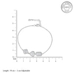Load image into Gallery viewer, Silver bracelet with three heart-shaped charms on a white background with measurement scale.
