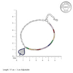 Load image into Gallery viewer, Silver bracelet with colorful heart charm and measurement scale on a white background
