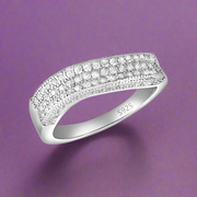 A 925 sterling silver ring with a studded eternity design and AAA cubic zirconias.