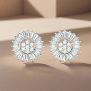 A pair of sterling silver baguette cut earrings studded with clear cubic zirconia, arranged in a circular pattern with a central point.