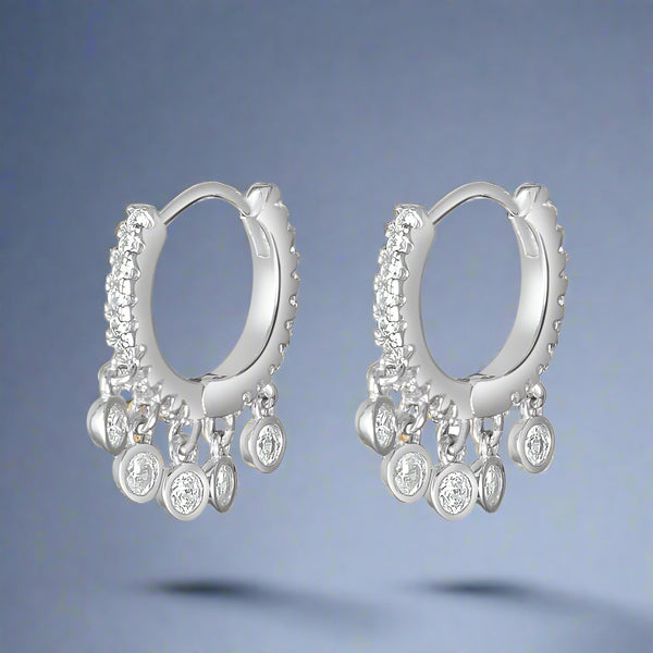 A pair of sterling silver Bali earrings with cubic zirconia embellishments.