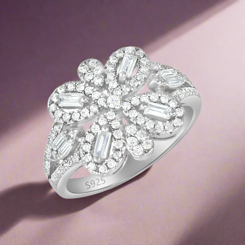 A 925 sterling silver ring with a bow-shaped design, adorned with cubic zirconia stones.