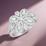 Load image into Gallery viewer, A 925 sterling silver ring with a bow-shaped design, adorned with cubic zirconia stones.
