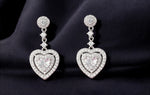 Load image into Gallery viewer, Deluxe Solitaire Heart - 925 Silver Heart Dangler Earrings

