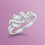 Load image into Gallery viewer, A sterling silver ring with multiple clear cubic zirconia embellishments.
