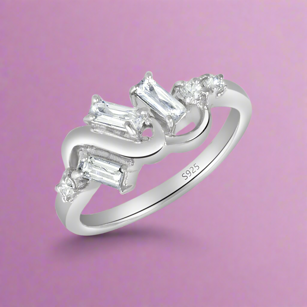 A sterling silver ring with multiple clear cubic zirconia embellishments.