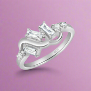 A sterling silver ring with multiple clear cubic zirconia embellishments.