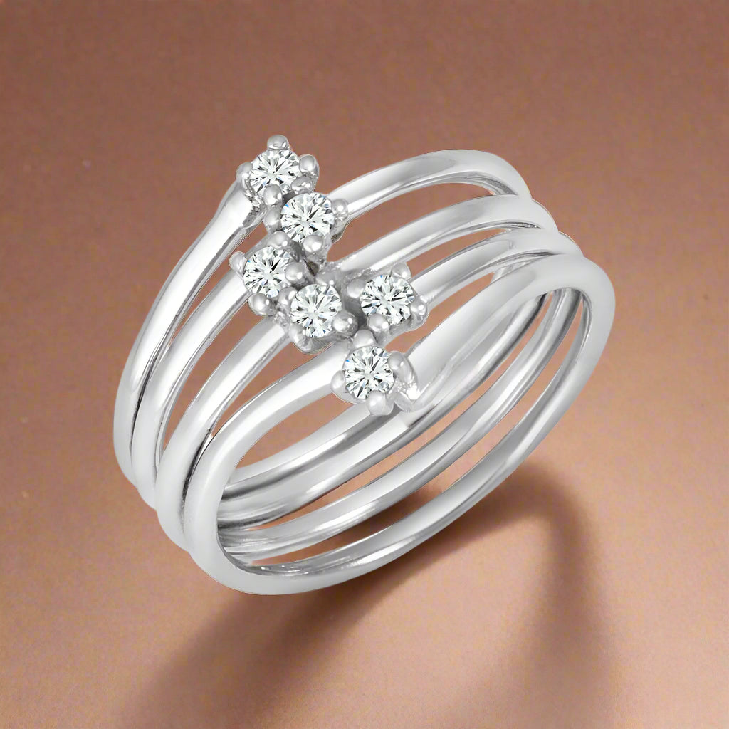 A sterling silver ring with multiple sparkling stones set around its circumference.