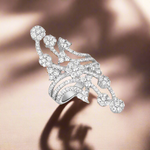 Load image into Gallery viewer, A 925 sterling silver ring with multiple sparkling stones set around its circumference.

