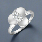 Load image into Gallery viewer, A 925 sterling silver ring with a flower-shaped design, studded with cubic zirconia, on a white background.
