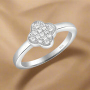 A 925 sterling silver ring with a clover-shaped design, studded with cubic zirconias.