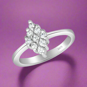 A sterling silver ring with multiple sparkling stones set around the band.