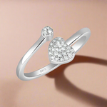 Load image into Gallery viewer, A 925 sterling silver ring with a heart-shaped design, adorned with cubic zirconia stones.
