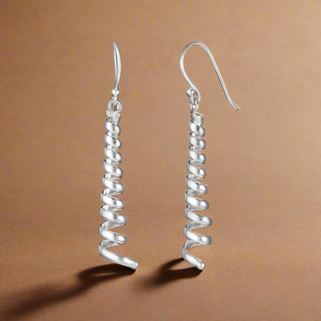 A pair of 925 sterling silver hoop earrings with a twist design, suitable for daily wear and special occasions.