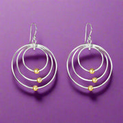 A pair of 925 sterling silver earrings featuring a two-tone link design with white and gold-colored accents.