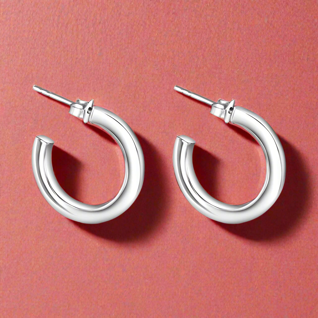 A pair of 925 Sterling Silver Hoop Earrings with a silver finish.
