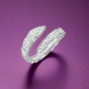 An elegant Charisma 925 sterling silver ring with a cubic zirconia center stone and intricate band design.