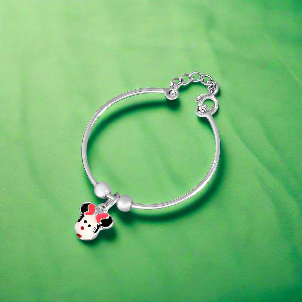 A silver bracelet featuring a charms with a cartoon character's face, designed for kids.