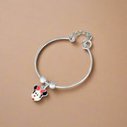 A silver bracelet featuring a charms with a cartoon character's face, designed for kids.